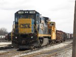 CSX 7498 waits with a caboose and three gons before starting tie pickup duty